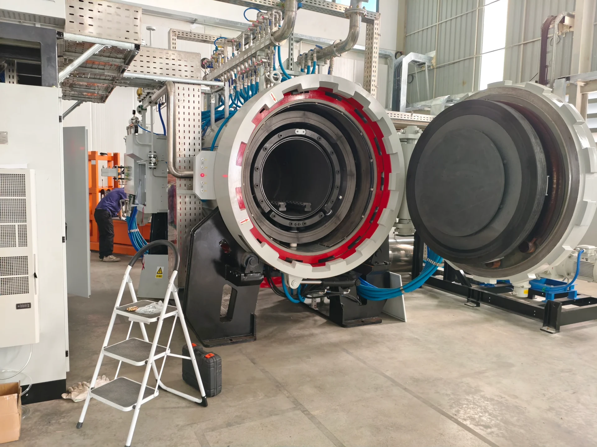 Sintering furnace with its chamber open at the Thailand factory during installation